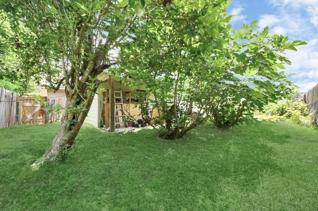 a view of a backyard with a garden