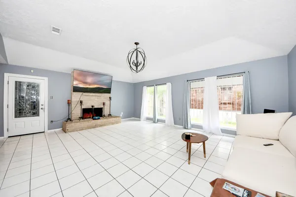 a view of a livingroom with furniture and windows