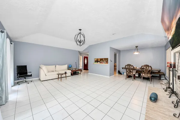 a bed room with a bed and a chair