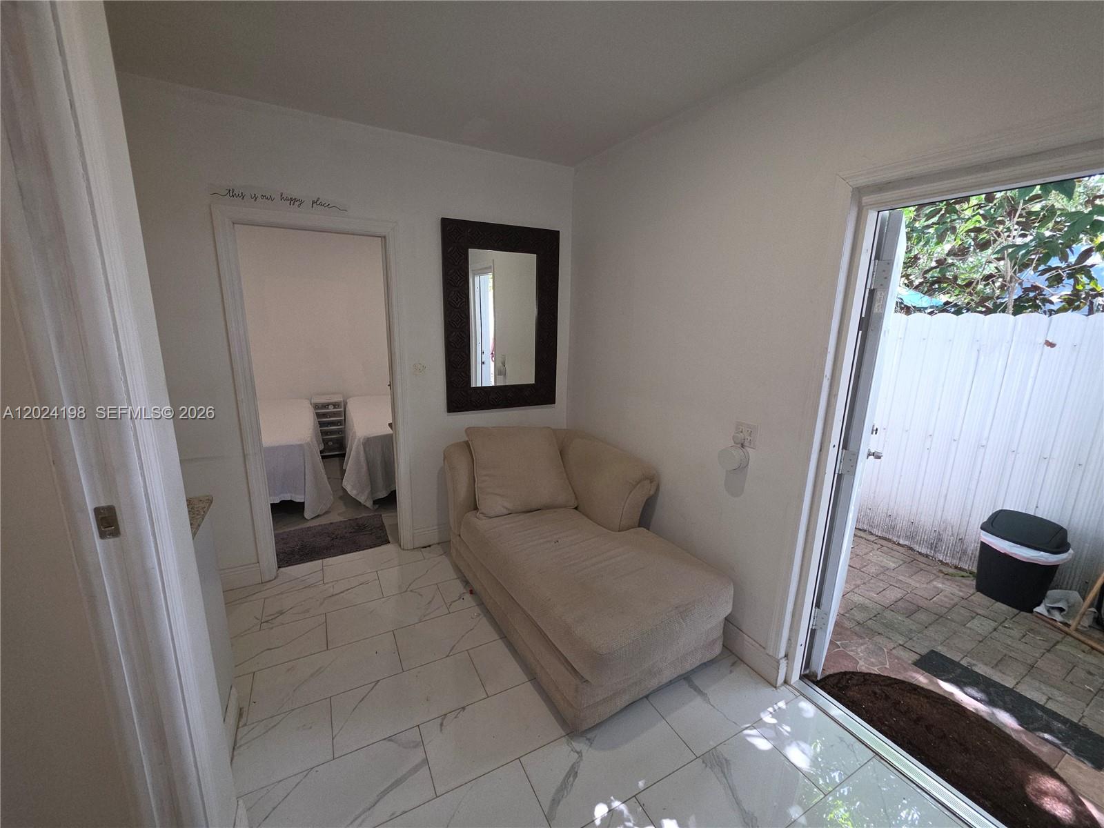 651 East 48th Street Hialeah, FL 33013 - Photo 37 of 52 a living room with a couch and a rug