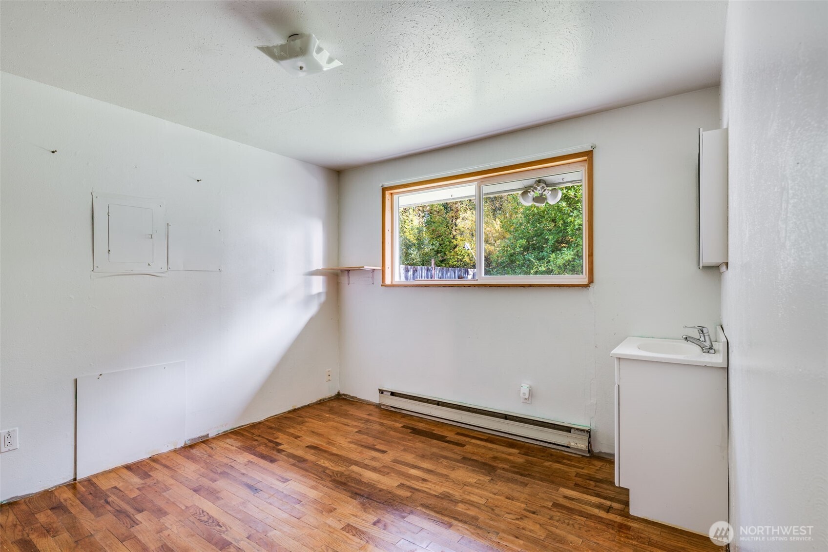 33526 18th Avenue South Federal Way, WA 98003 - Photo 17 of 31 a view of empty room with wooden floor and fan
