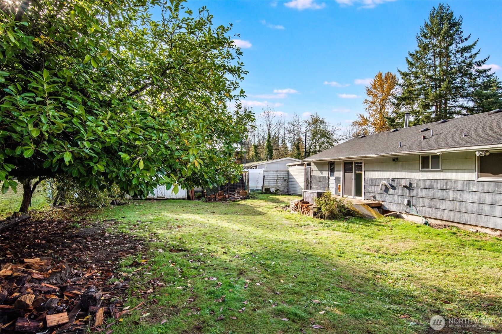 33526 18th Avenue South Federal Way, WA 98003 - Photo 23 of 31 a view of a house with a yard and sitting area