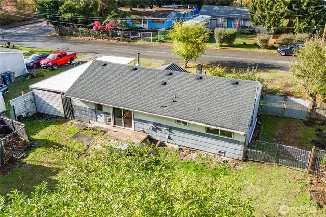 a aerial view of a house with swimming pool garden and patio