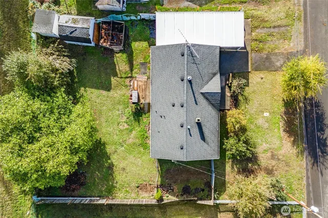 an aerial view of a house with swimming pool