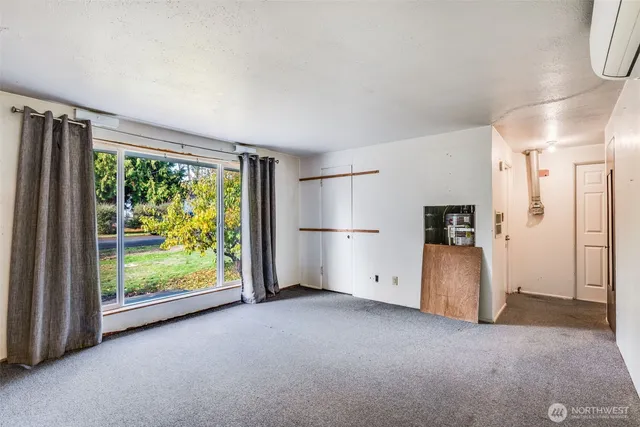 a view of an empty room with a window