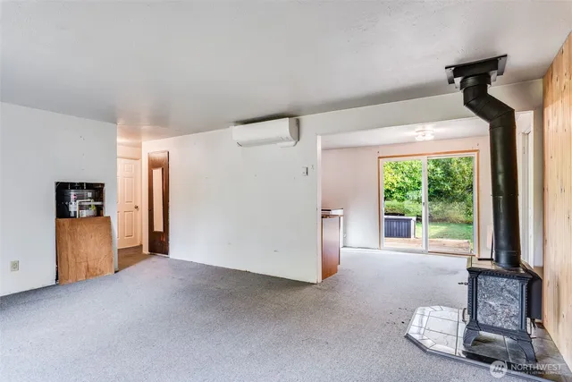 a view of a livingroom with furniture and a window