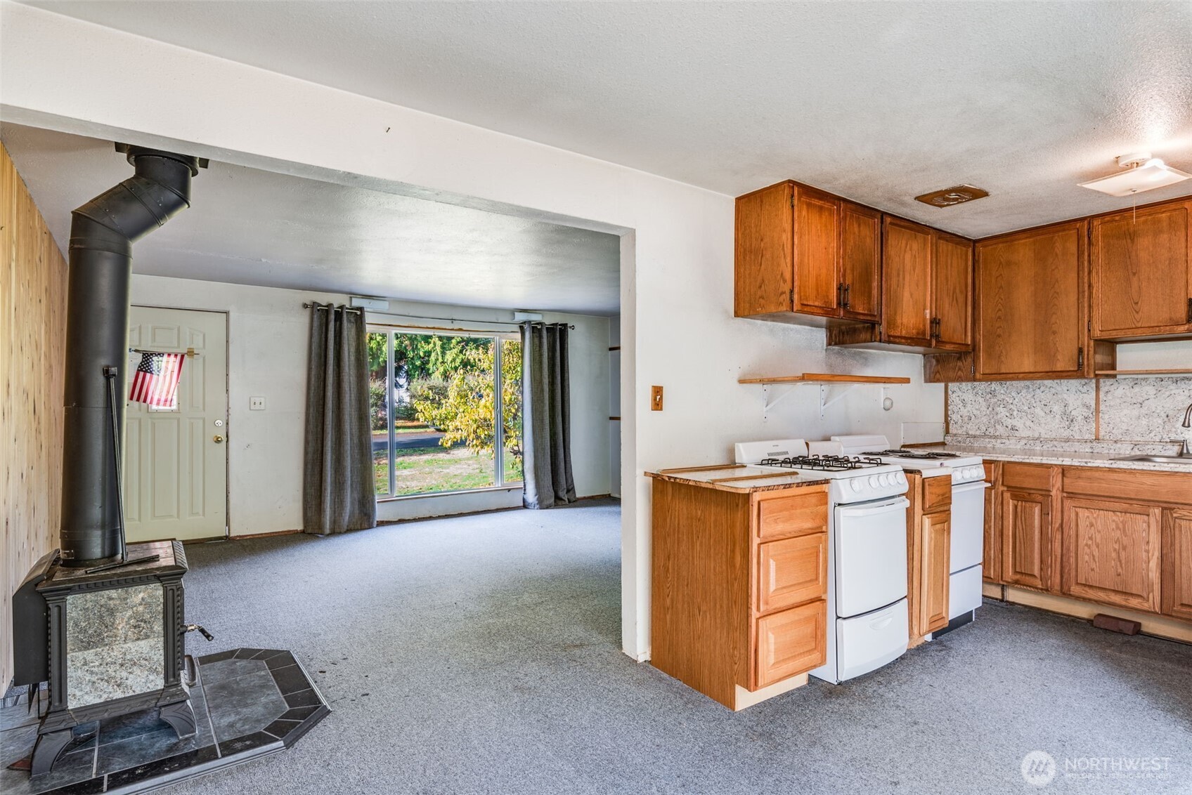 33526 18th Avenue South Federal Way, WA 98003 - Photo 5 of 31 a kitchen with stainless steel appliances granite countertop a stove a sink and a refrigerator