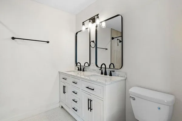 a bathroom with a shower and a toilet