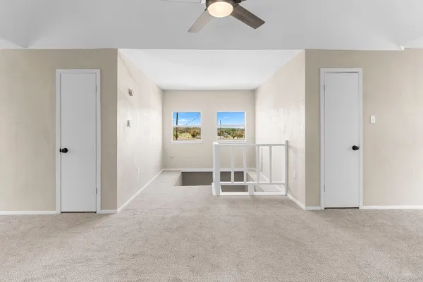 a bathroom with double vanity sink and a mirror