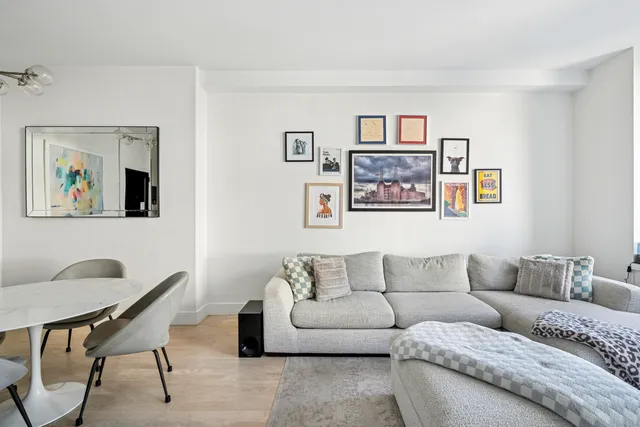 a kitchen with a stove a sink and a window