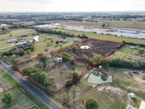 a view of a pathway with a wrought fence
