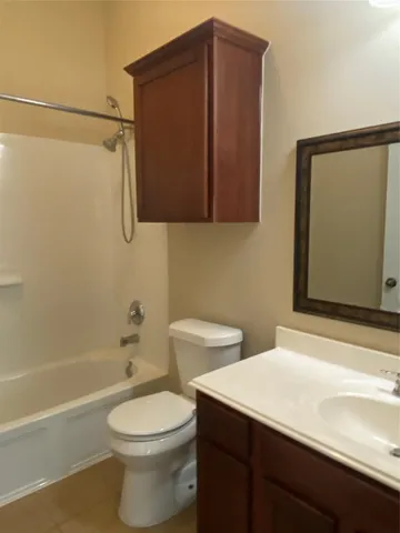 a bathroom with a toilet a sink and bathtub
