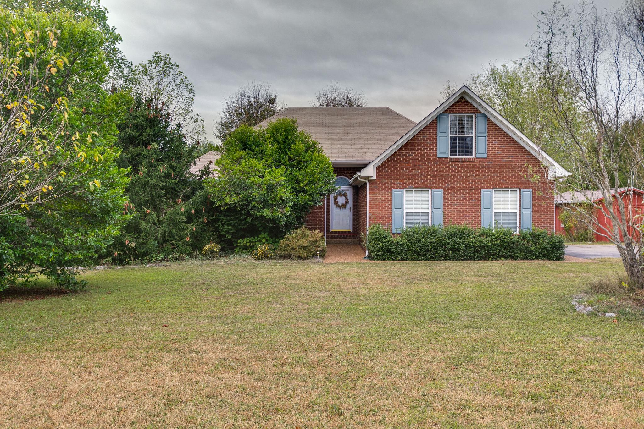 1900 Victorian Road Columbia, TN 38401 - Photo 1 of 24 a front view of a house with a garden