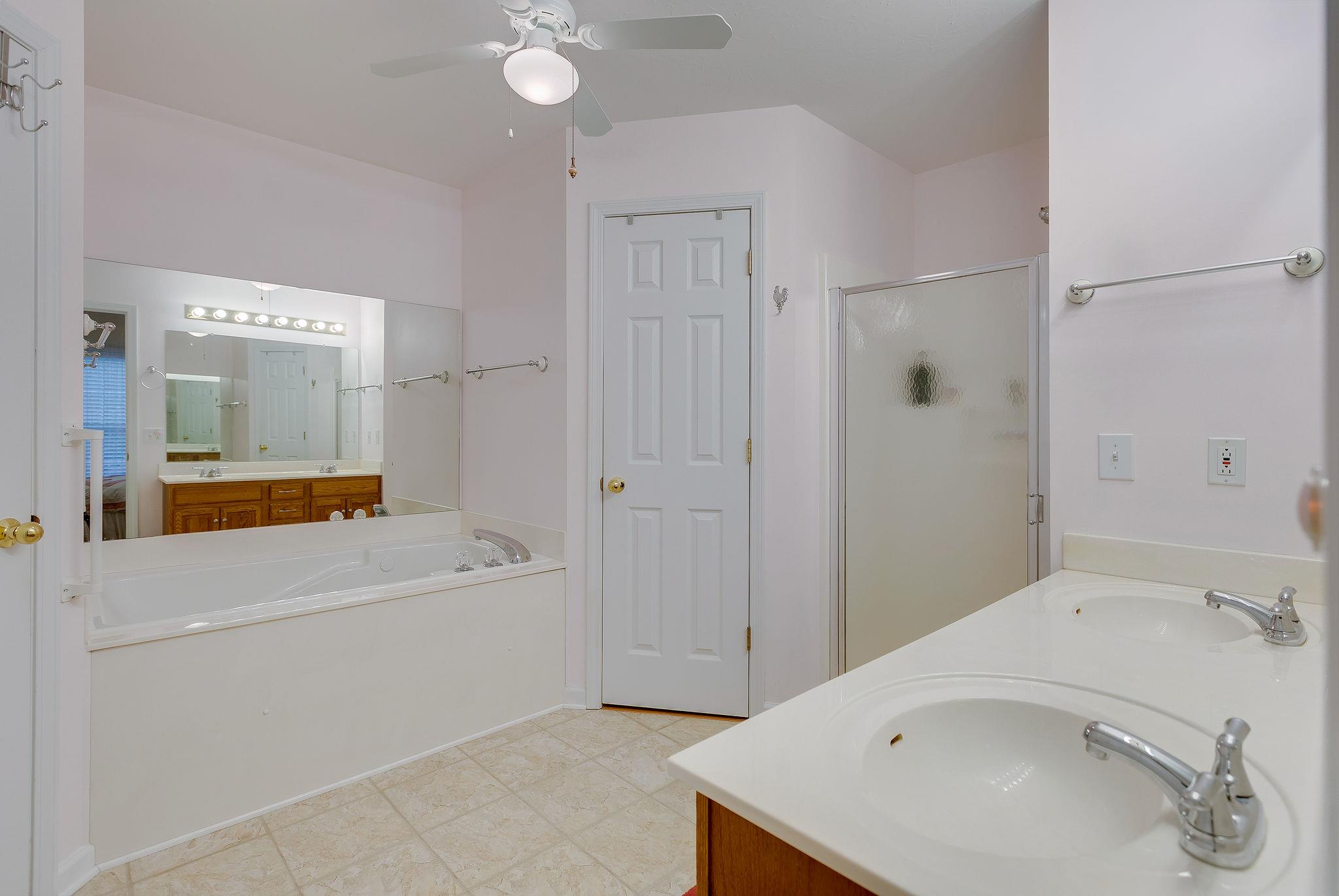 1900 Victorian Road Columbia, TN 38401 - Photo 12 of 24 a bathroom with a sink a bathtub and a mirror