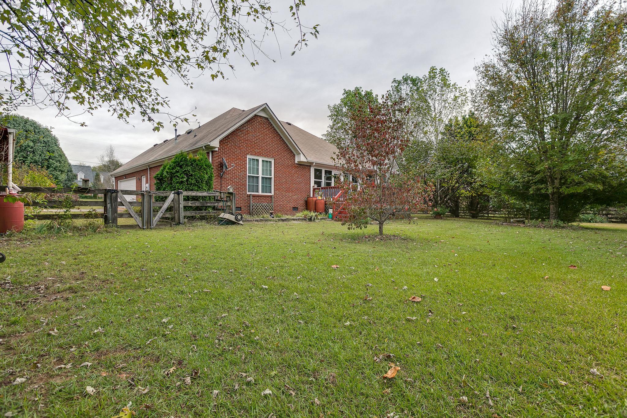 1900 Victorian Road Columbia, TN 38401 - Photo 19 of 24 a front view of a house with a yard and trees
