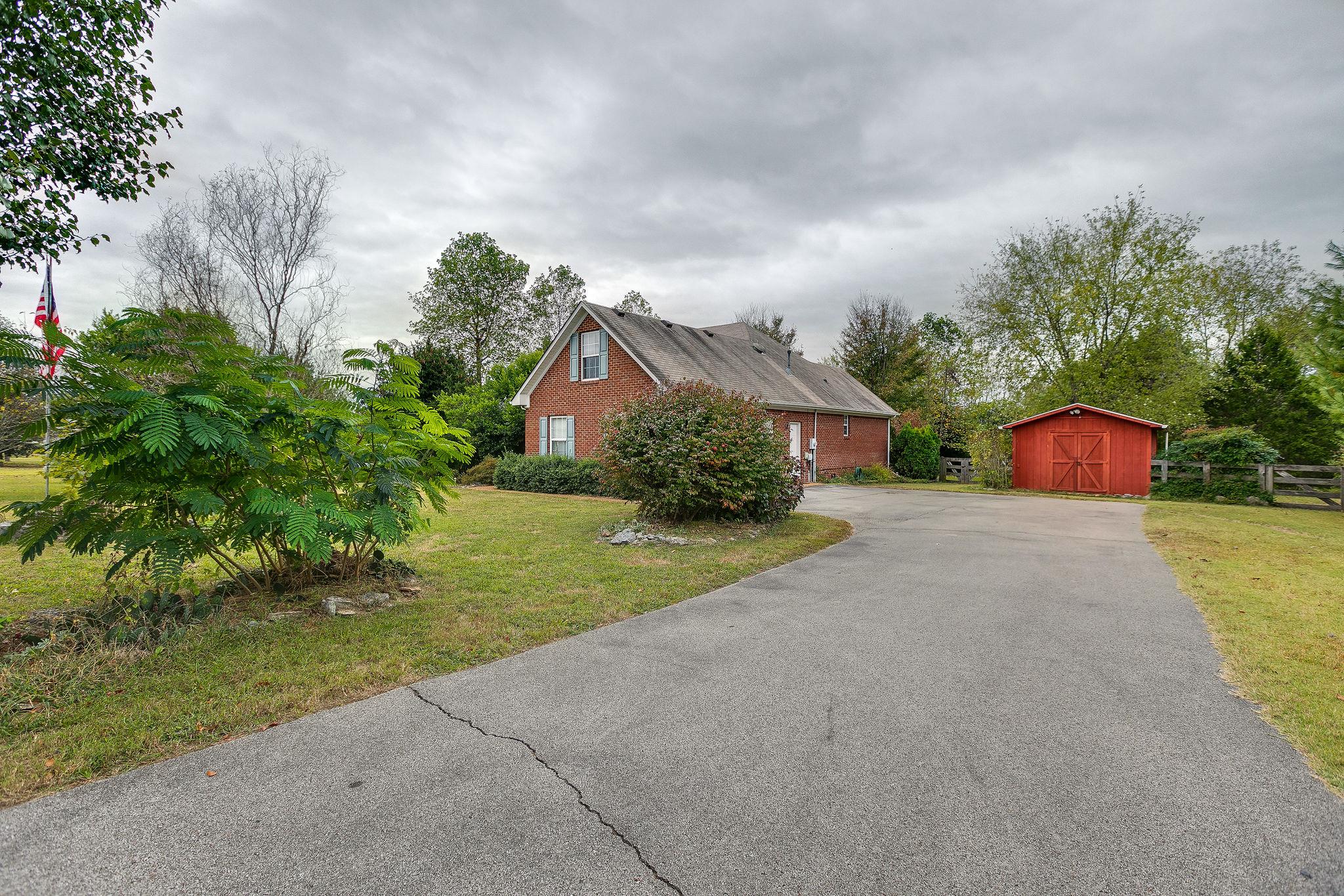 1900 Victorian Road Columbia, TN 38401 - Photo 20 of 24 a front view of a house with a yard and garage