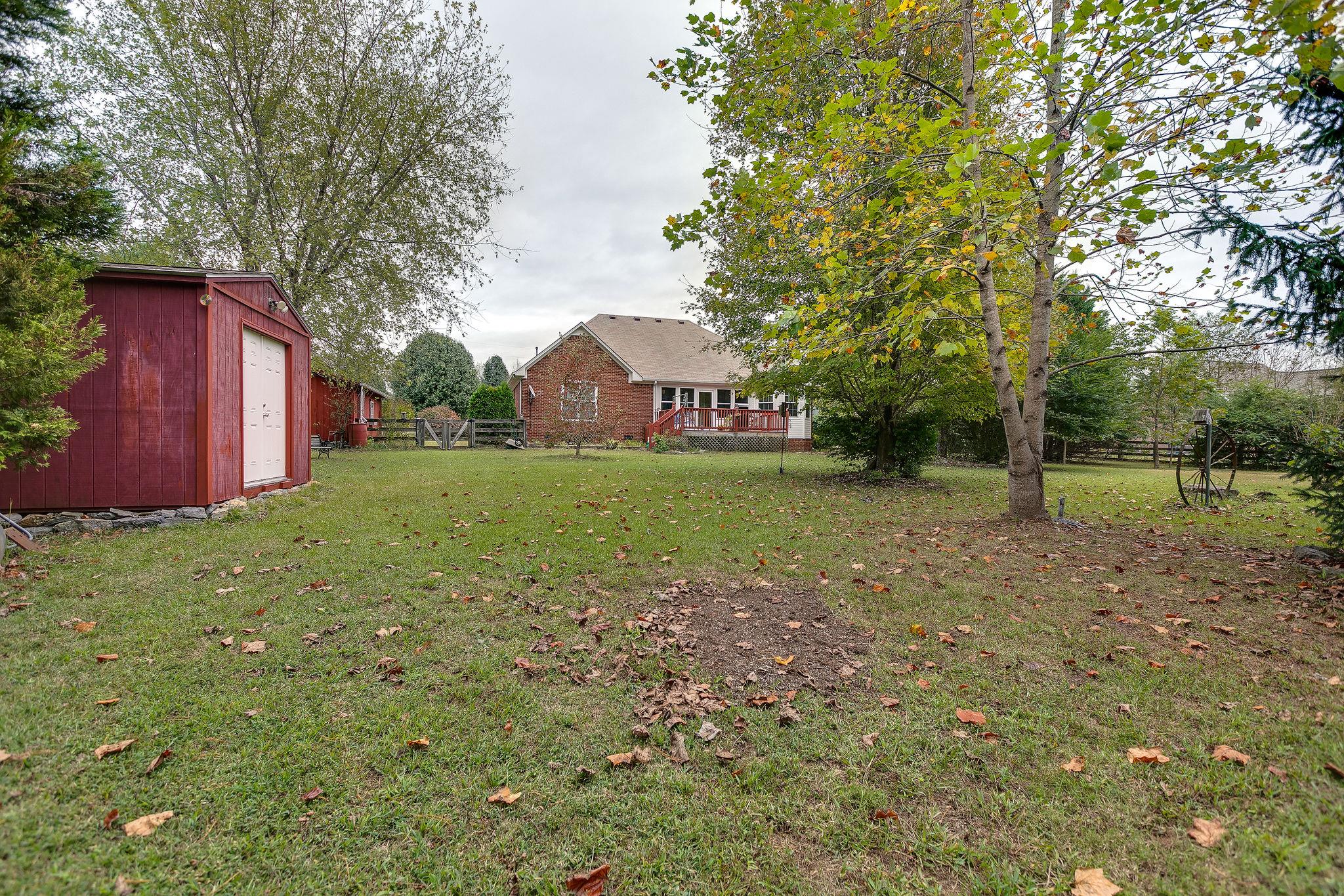 1900 Victorian Road Columbia, TN 38401 - Photo 22 of 24 a view of a backyard with large trees