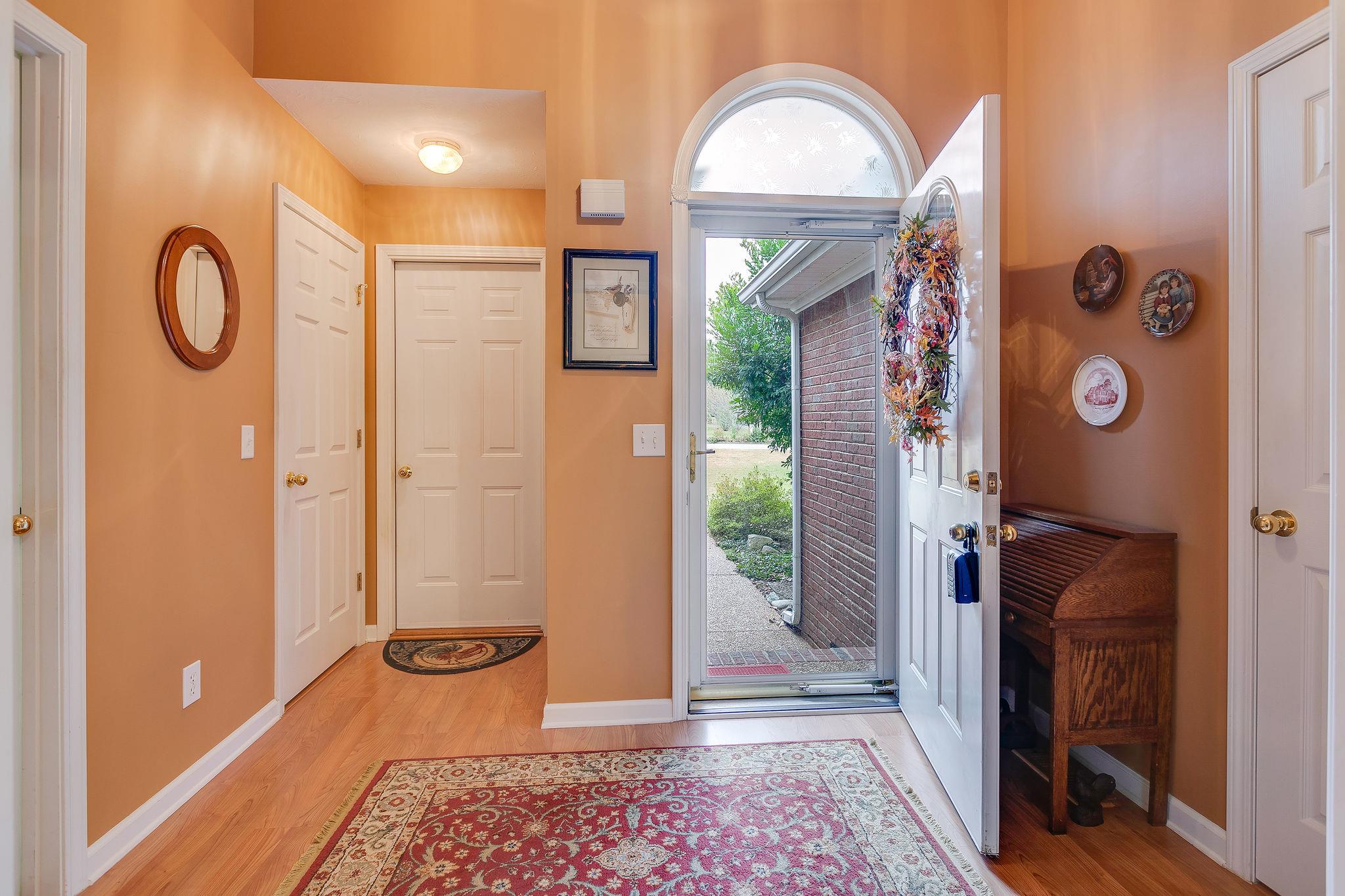 1900 Victorian Road Columbia, TN 38401 - Photo 3 of 24 a view of an entryway with a mirror and a door