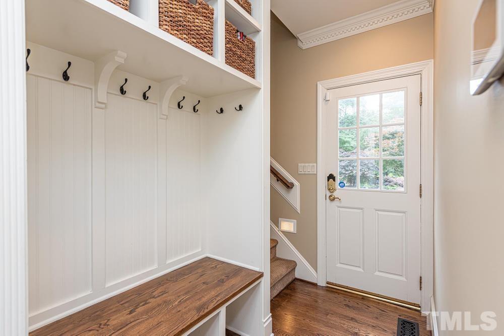 313 Jellison Court Raleigh, NC 27615 - Photo 14 of 30 Drop zone behind Kitchen with rear stair access to Bonus Room, door to garage, and back deck.