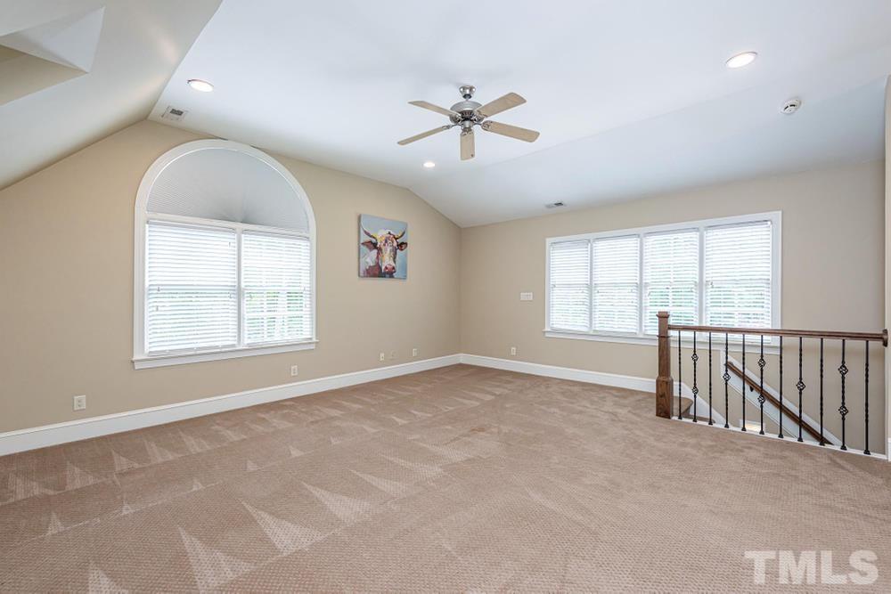 313 Jellison Court Raleigh, NC 27615 - Photo 15 of 30 Bonus Room with palladium, ceiling fan, and view from side windows overlooking private backyard.