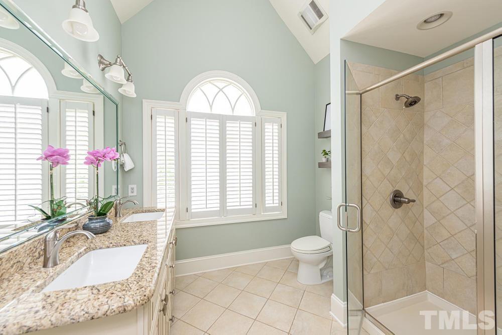 313 Jellison Court Raleigh, NC 27615 - Photo 24 of 30 Full Bathroom on upper level with large walk in shower and dual vanity sinks.