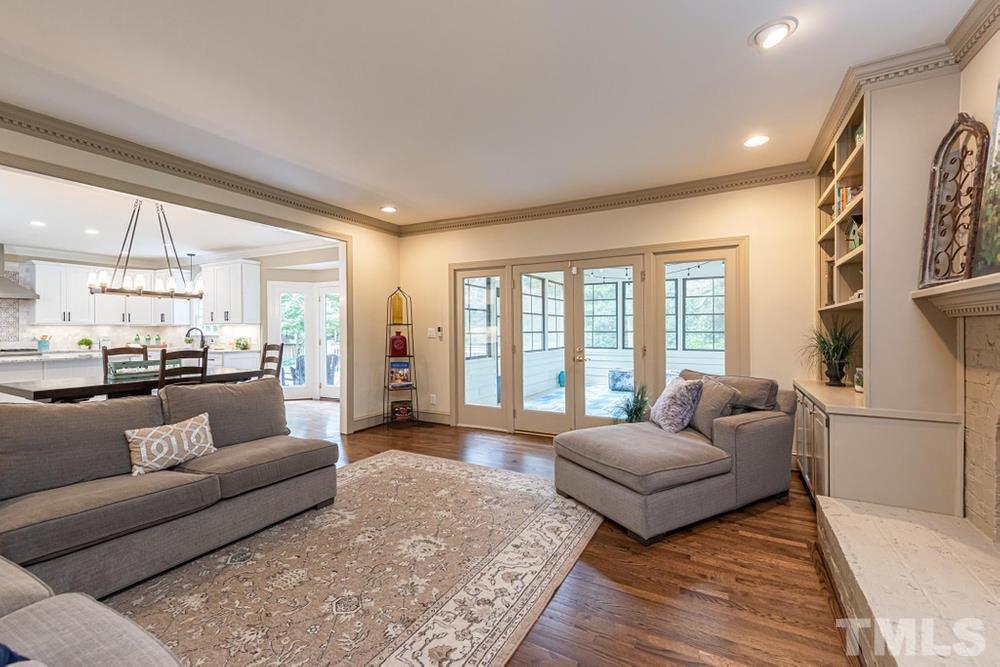 313 Jellison Court Raleigh, NC 27615 - Photo 10 of 30 Double doors in Family Room lead out to the Screened Porch.
