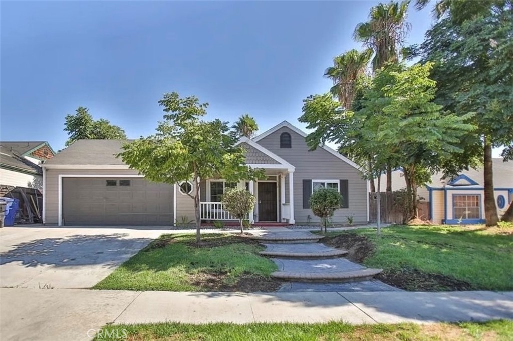 1164 Massachusetts Avenue Riverside, CA 92507 - Photo 1 of 14 a front view of a house with a yard and trees