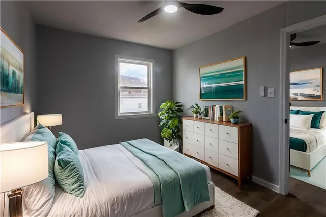 a bedroom with a bed and a window