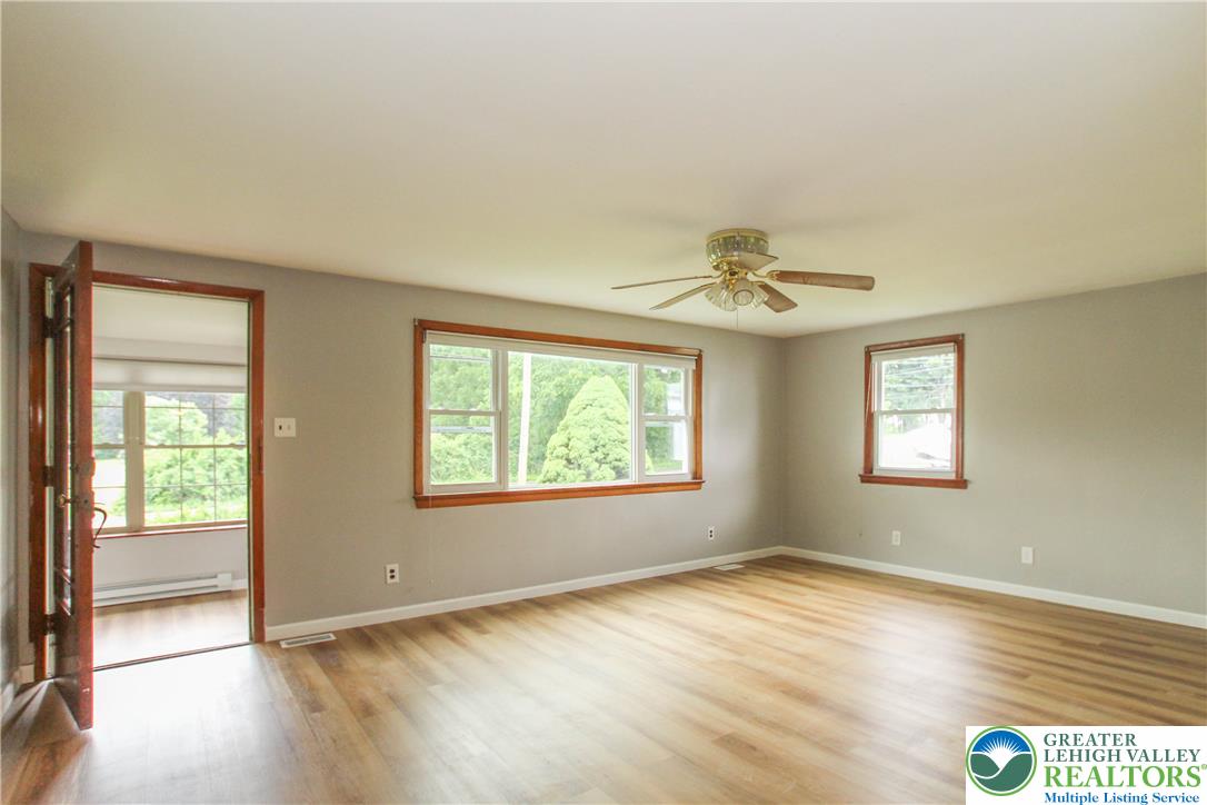 492 Filetown Road Nazareth, PA 18064 - Photo 11 of 30 A versatile living space with light wood flooring and plentiful natural illumination from multiple windows.