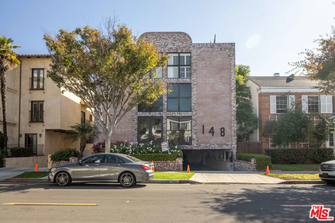 148 South Reeves Drive, Unit 4 Beverly Hills, CA 90212 - Photo 2 of 15 a car parked in front of a house