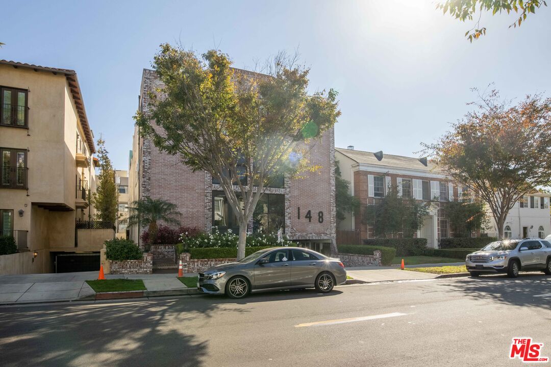 148 South Reeves Drive, Unit 4 Beverly Hills, CA 90212 - Photo 3 of 15 a view of street with parked cars