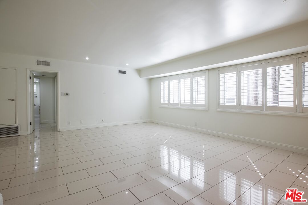148 South Reeves Drive, Unit 4 Beverly Hills, CA 90212 - Photo 6 of 15 a view of an empty room with window