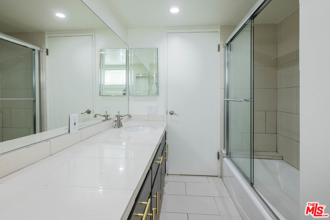 148 South Reeves Drive, Unit 4 Beverly Hills, CA 90212 - Photo 9 of 15 a bathroom with a bathtub and a sink