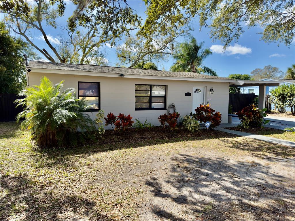 3810 Johnson Street Orlando, FL 32805 - Photo 2 of 18 front view of a house with a yard
