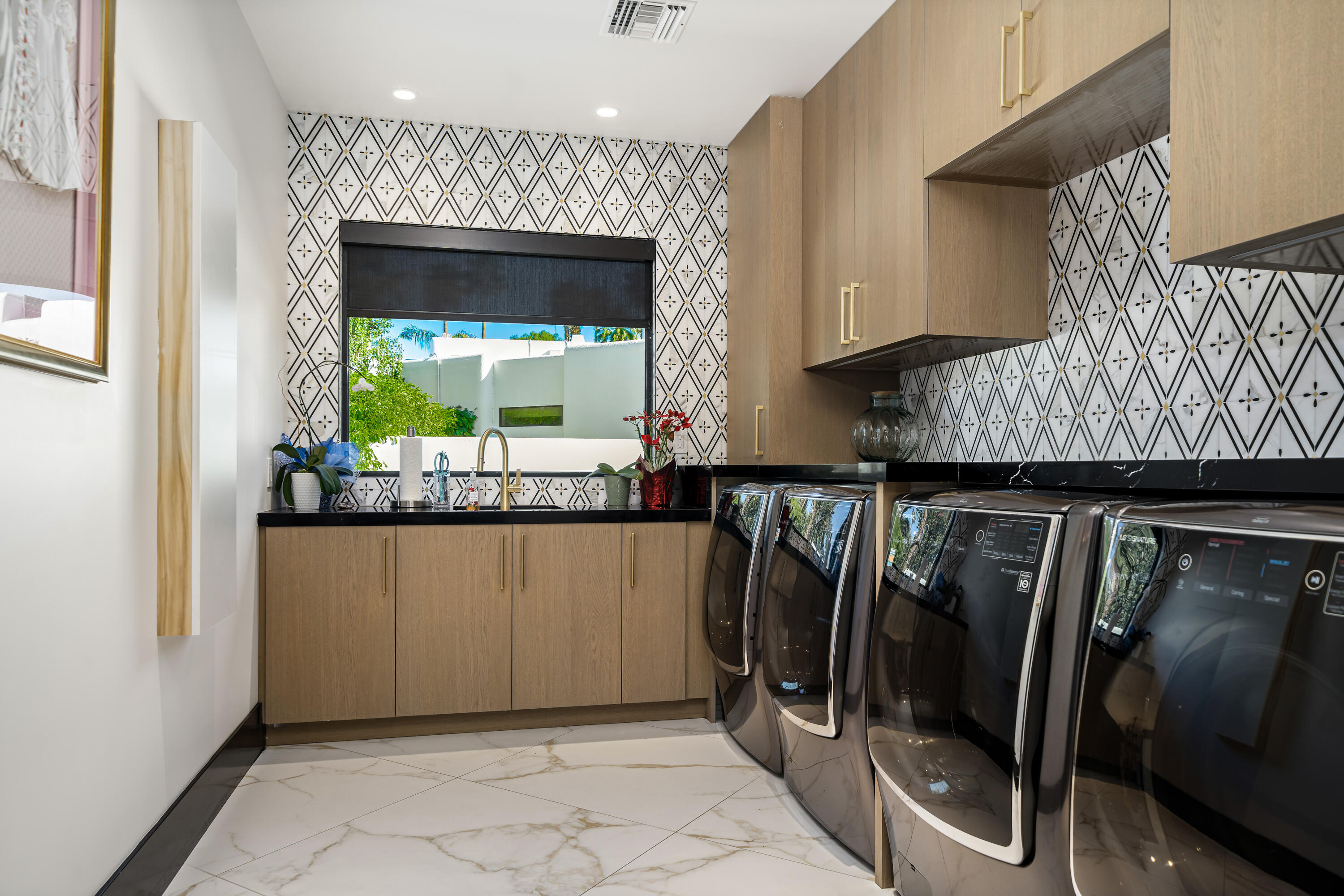 40440 Morningstar Road Rancho Mirage, CA 92270 - Photo 54 of 64 Laundry with double washer and dryers