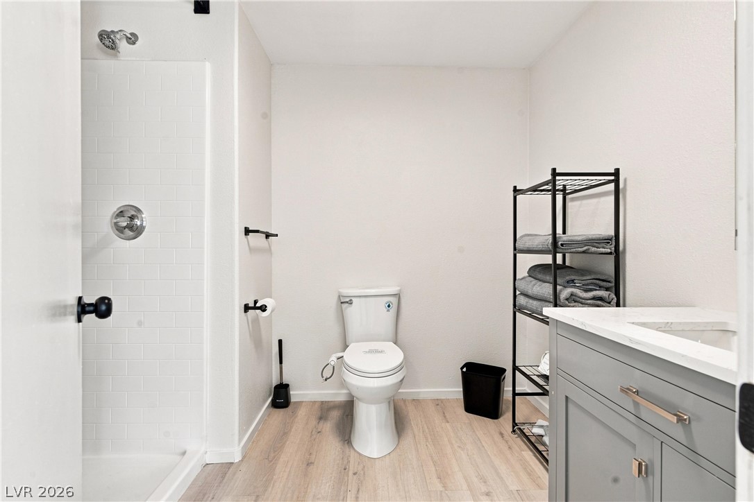 7744 Rancho Destino Road Las Vegas, NV 89123 - Photo 9 of 48 Clean lines and a walk-in tile shower define this modern bathroom space.