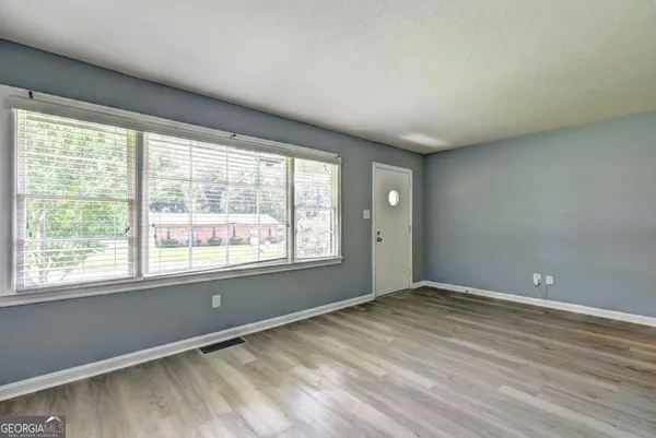 a view of an empty room with a window