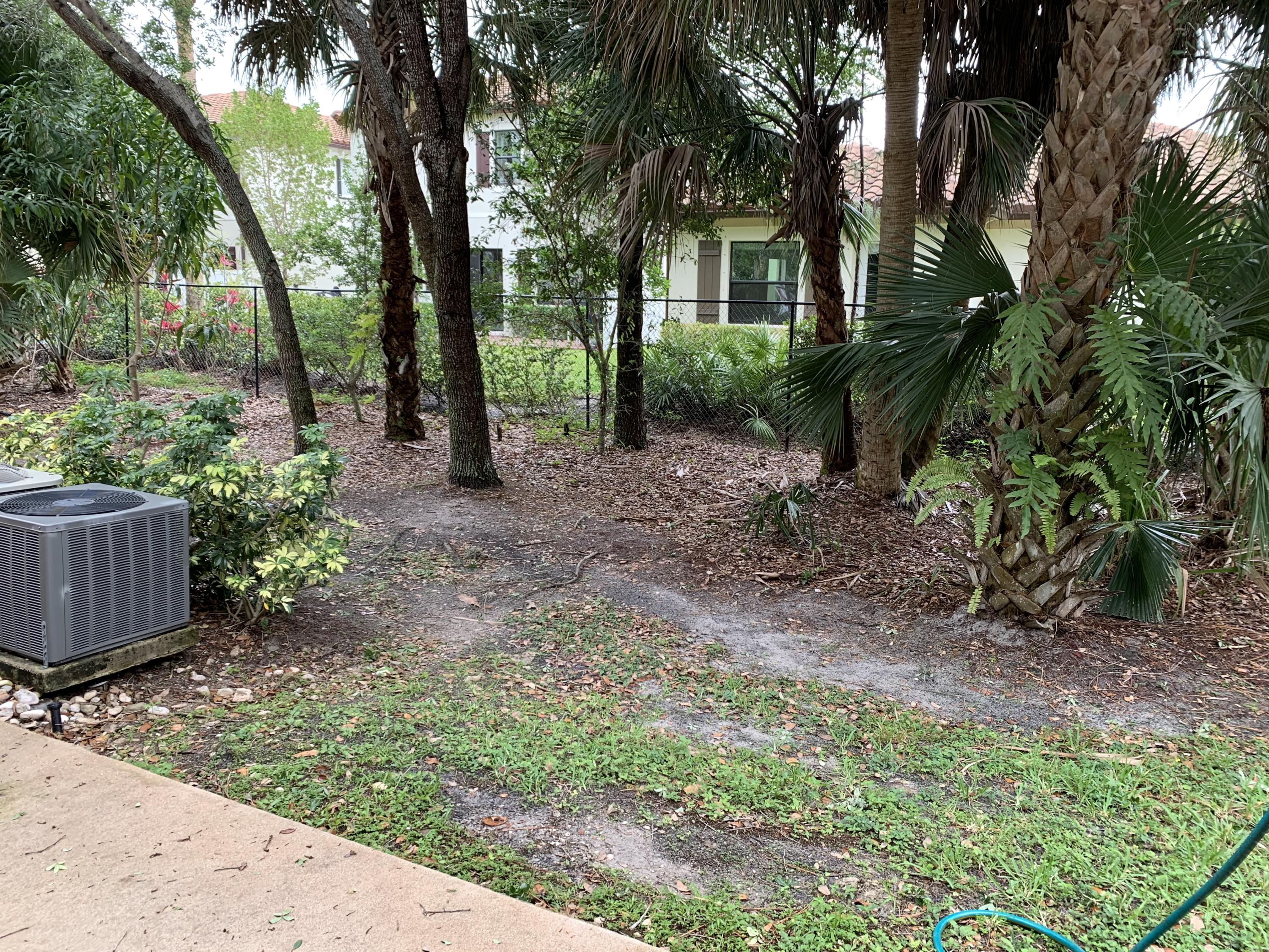 1055 Woodfield Road Greenacres, FL 33415 - Photo 19 of 20 Rear patio/backyard