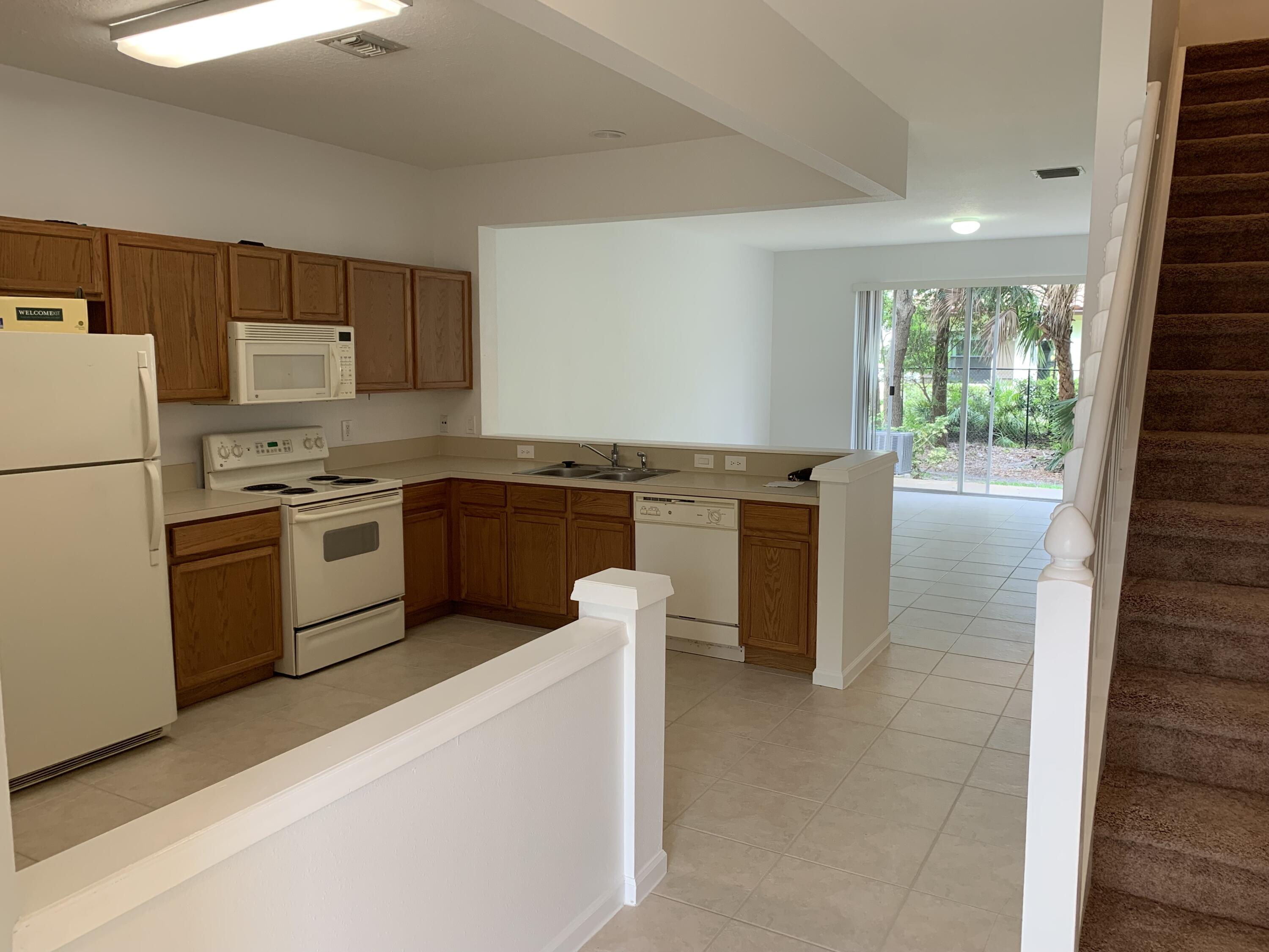 1055 Woodfield Road Greenacres, FL 33415 - Photo 3 of 20 Through front door