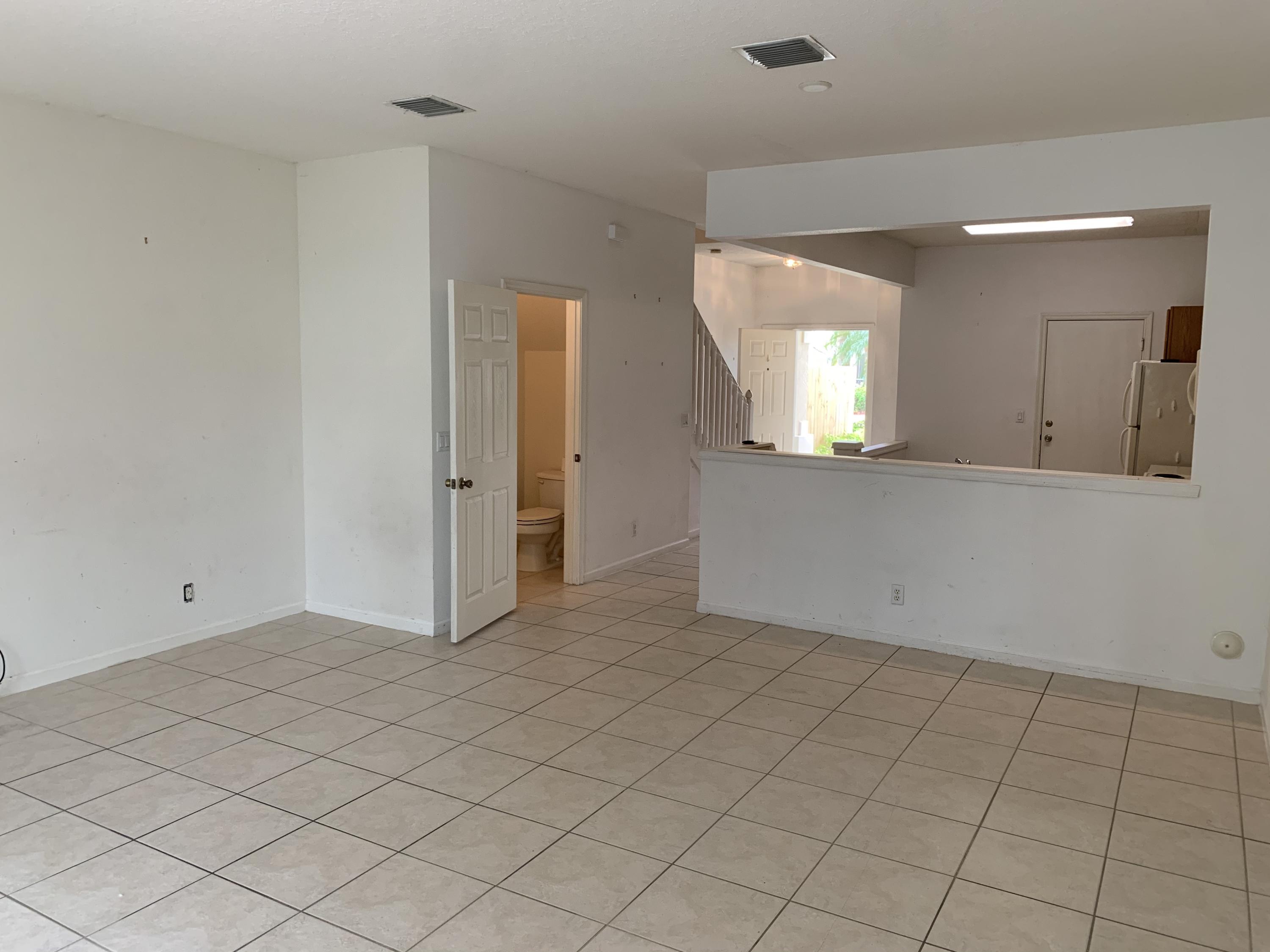 1055 Woodfield Road Greenacres, FL 33415 - Photo 7 of 20 Family room 2