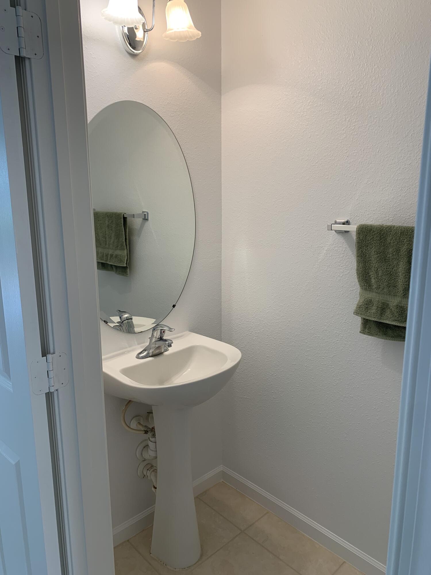 1055 Woodfield Road Greenacres, FL 33415 - Photo 8 of 20 Downstairs Half bath