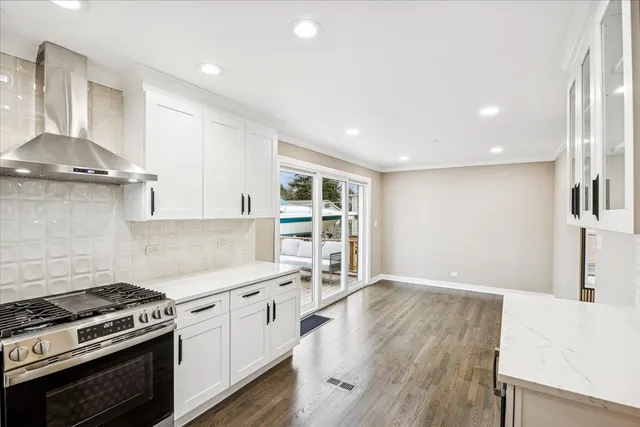 a kitchen with granite countertop a stove and a sink