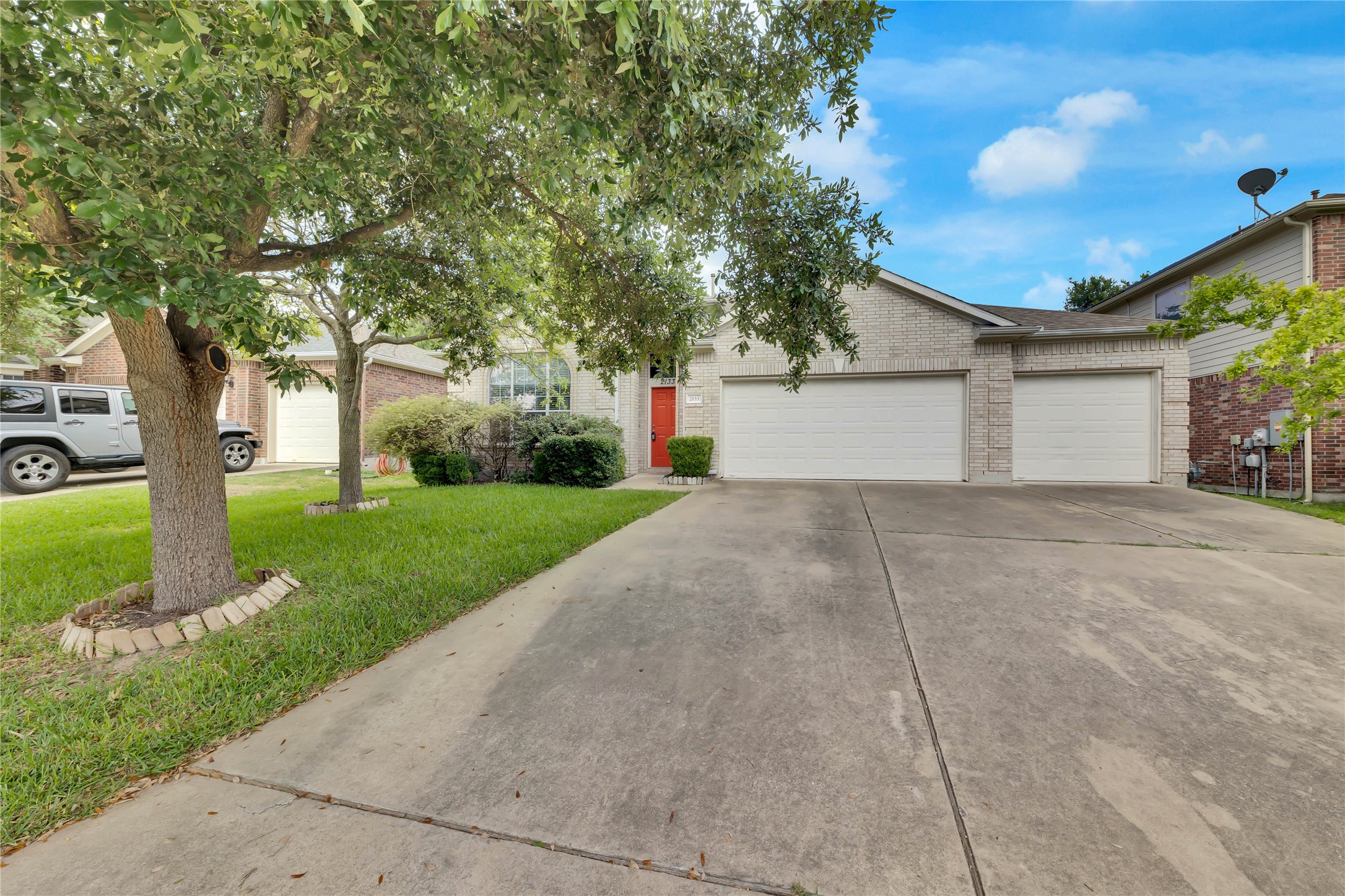 2133 Paradise Ridge Drive Round Rock, TX 78665 - Photo 1 of 22 Contemporary brick exterior with a prominent red entry door