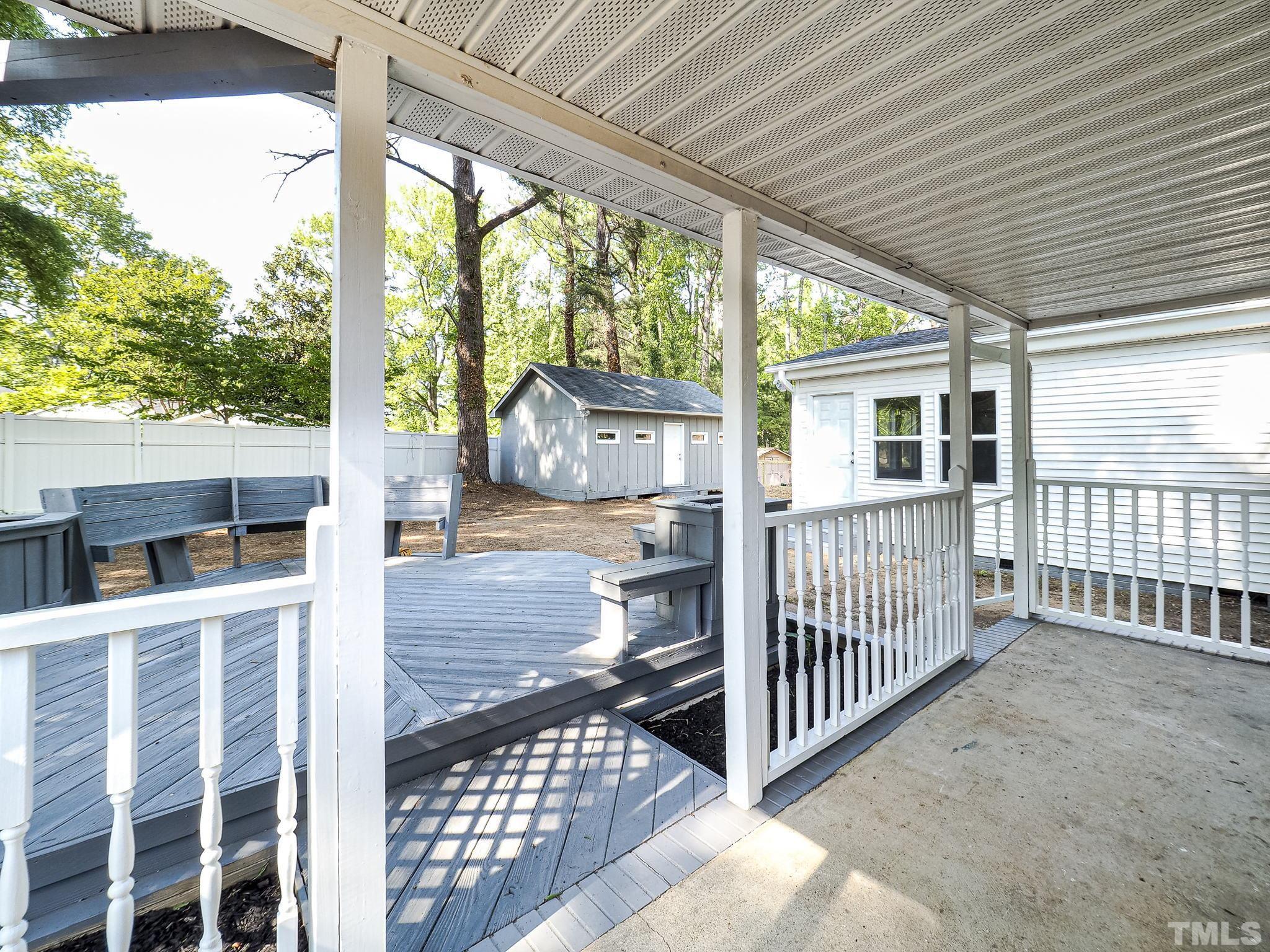 626 Winterlochen Road Raleigh, NC 27603 - Photo 6 of 16 a view of a porch with wooden floor