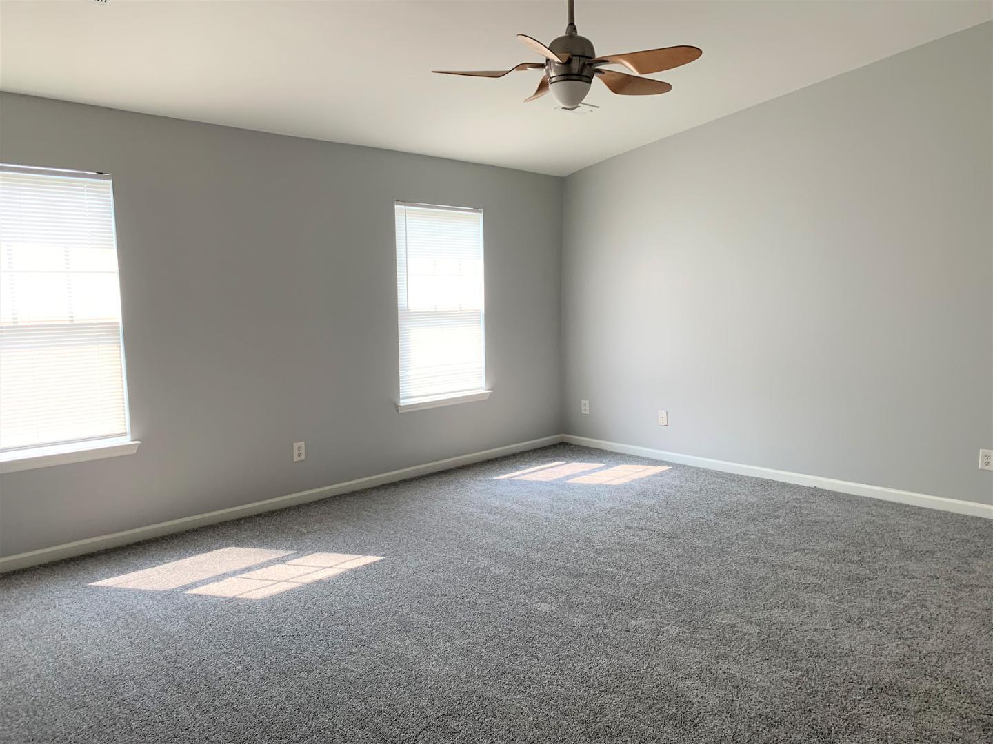 11721 Coppergate Drive, Unit 107 Raleigh, NC 27614 - Photo 5 of 5 an empty room with a empty space and a window