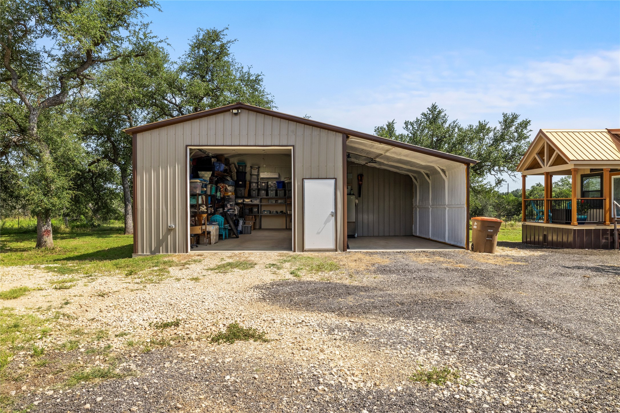 8200 Ranch Road 12 San Marcos, TX 78666 - Photo 26 of 40 A versatile metal structure offers ample storage and covered parking, perfect for diverse needs.