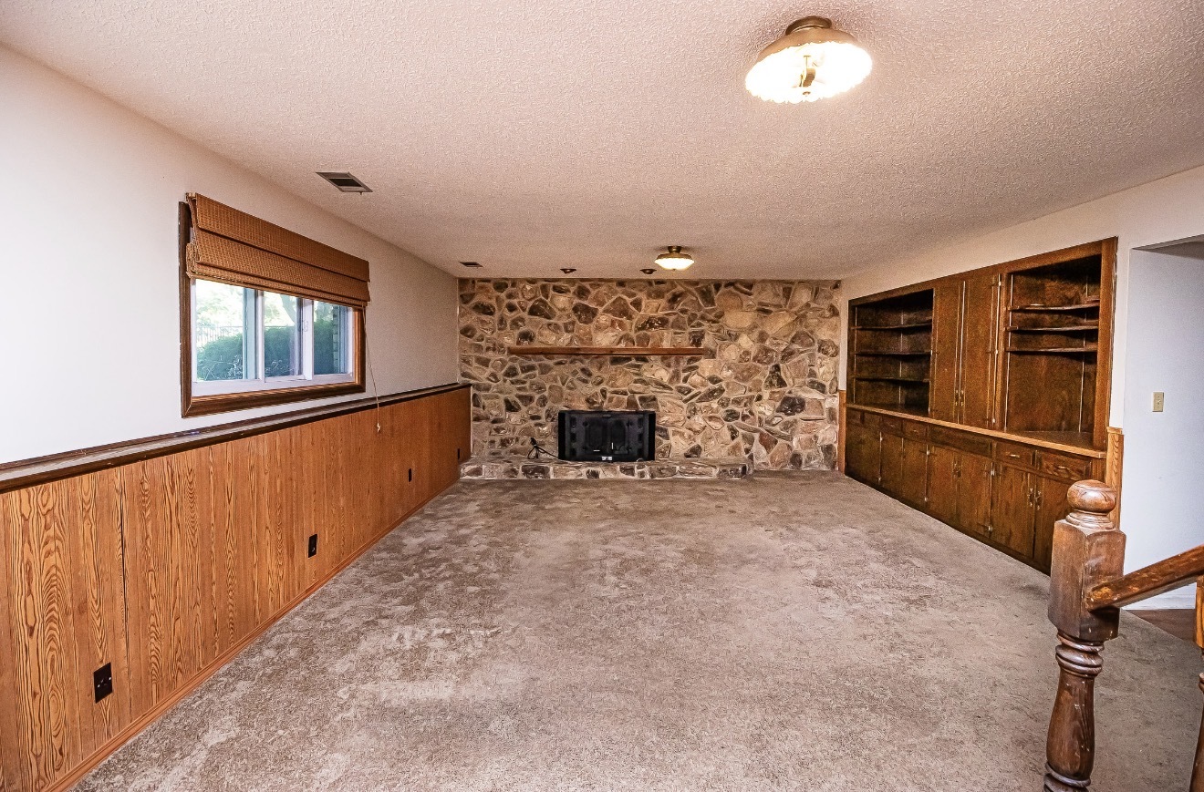 911 Colonade Road Shorewood, IL 60404 - Photo 23 of 36 a view of a livingroom with wooden floor and stairs