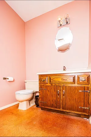 an empty room with a window and a ceiling fan