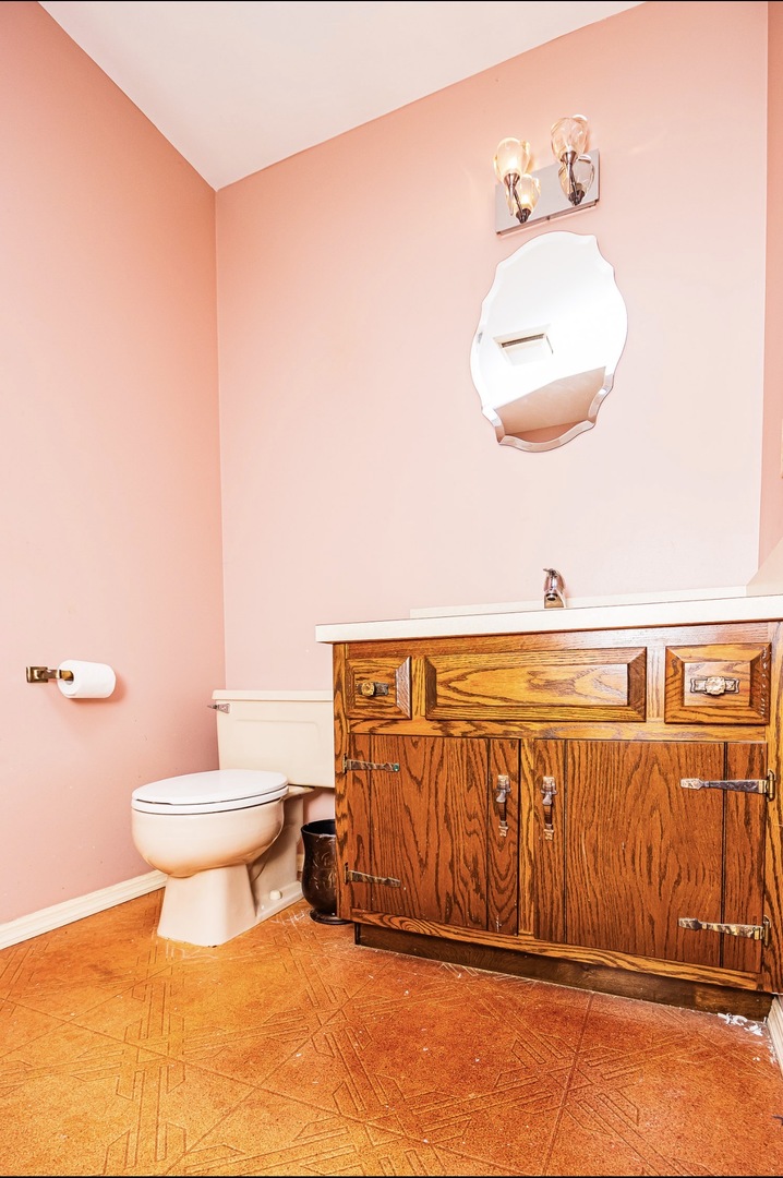 911 Colonade Road Shorewood, IL 60404 - Photo 30 of 36 a bathroom with a sink and a toilet