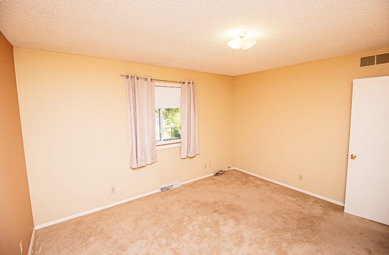 911 Colonade Road Shorewood, IL 60404 - Photo 36 of 36 an empty room with a empty space and a window
